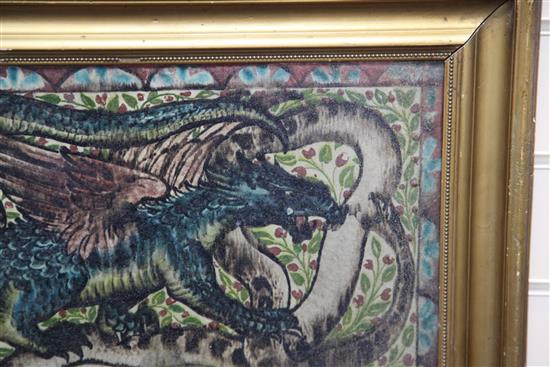 Attributed to John Pearson. An Arts & Crafts dragon and serpent pottery plaque, c.1905, 29 x 50.5cm, gilt frame